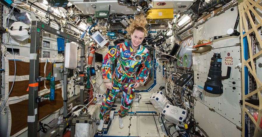 NASA astronaut Kate Rubins wearing a replica of the COURAGE space suit