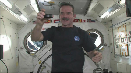 Hadfield drops the puck from the ISS during the Maple Leafs home opener