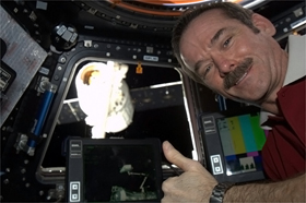 Photo of Chris Hadfield being a happy crewmember