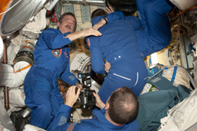 Photo of Chris Hadfield welcoming Expedition 35