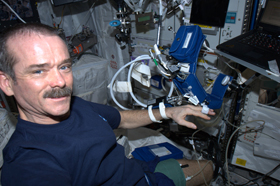 Hadfield, wearing hardware to monitor his blood pressure