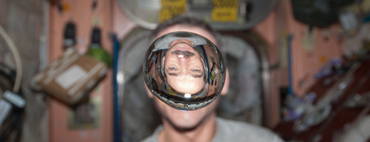 Chris Hadfield's image is refracted through a free-floating bubble