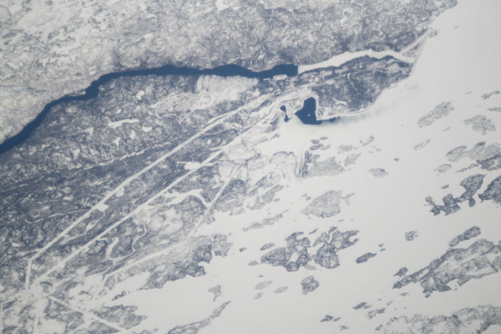 The Robert-Bourassa generating station is the main facility of the James Bay hydroelectric project, a large hydroelectric complex built on the La Grande River. It is Canada's largest hydroelectric power station and its spillway and powerline paths are visible from space as shown in this picture taken by David Saint-Jacques from the International Space Station. (Credit: Canadian Space Agency/NASA)