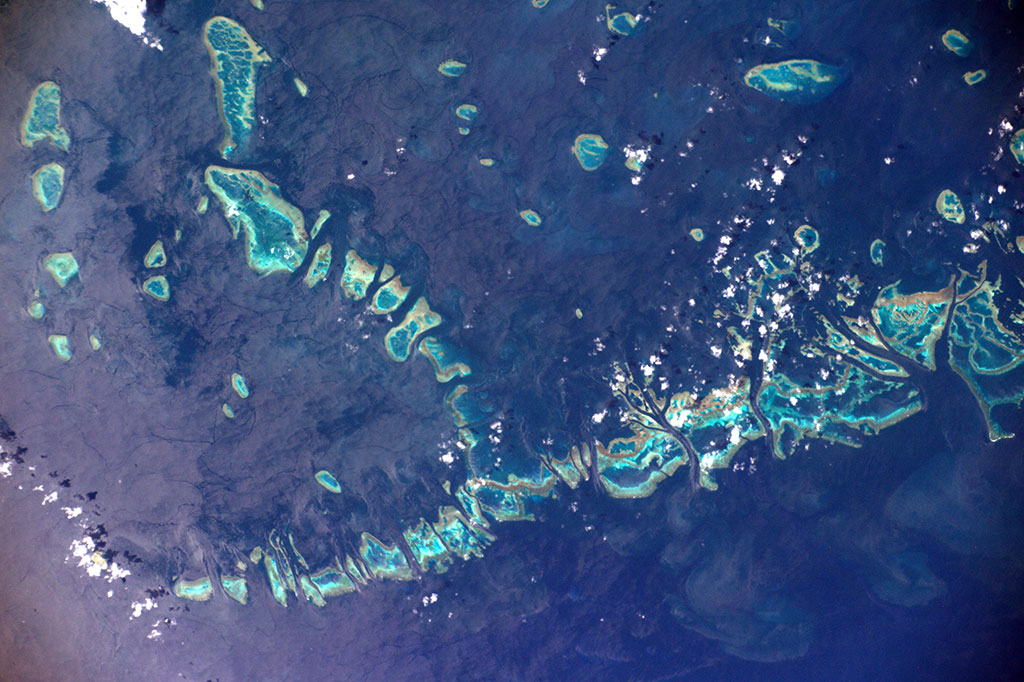 The Great Barrier Reef, a UNESCO World Heritage Site, is the world\'s largest coral reef system composed of over 2,900 individual reefs and 900 islands stretching for over 2,300 kilometres, off the coast of Australia. This photo was taken by French astronaut Thomas Pesquet from the International Space Station. (Credit: European Space Agency)