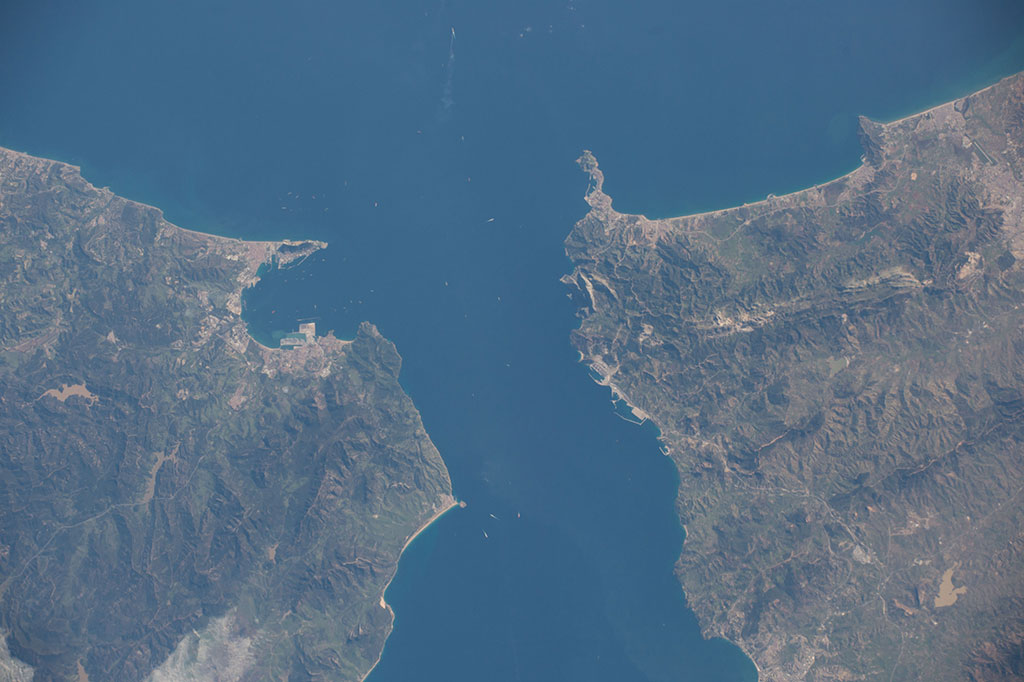 The Strait of Gibraltar is 58 kilometers long and slims down to 13 kilometers at its narrowest point. Approximately 60,000 vessels transit through it every year according to the Gibraltar Port Authority. Several can be seen in this photo taken by an astronaut aboard the International Space Station. (Credit: NASA)