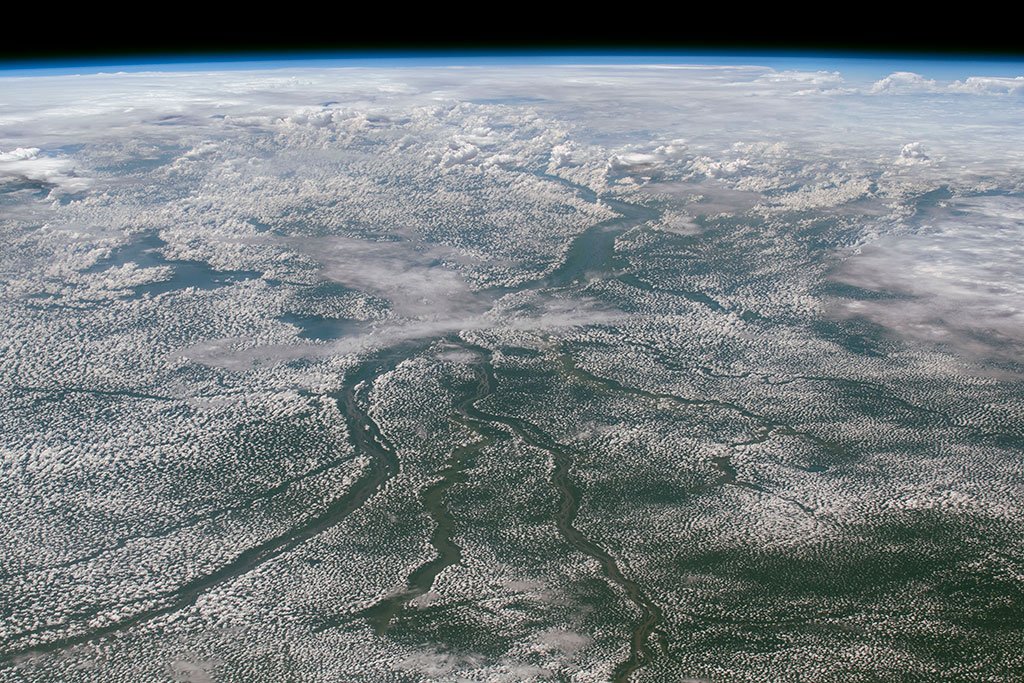 This photo of the Congo River Basin, in Central Africa, was taken by an astronaut aboard the International Space Station. It is the second biggest river basin in the world after the Amazon. It is adjacent to the Nile basin and is home to one of the richest and most diverse tropical forests on the planet. (Credit: NASA)
