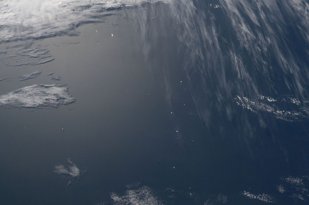 The small white dots at the bottom of this photo are large icebergs captured by David Saint-Jacques from the International Space Station. (Credit: Canadian Space Agency/NASA)
