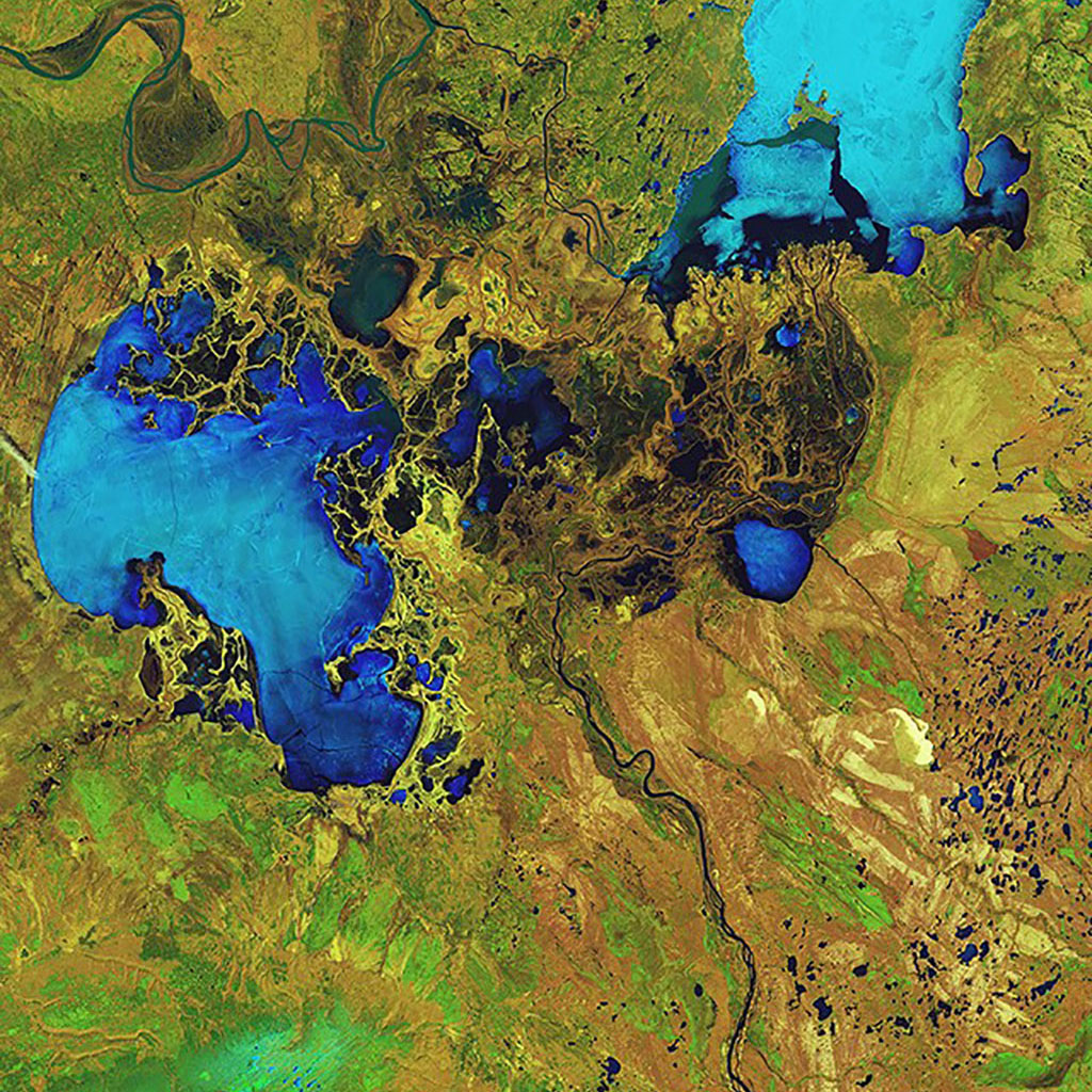 The lower half of this Landsat-8 satellite image shows the Athabasca oil sands, in Alberta. It is the world's largest known reservoir of crude bitumen. (Credit: USGS/European Space Agency)