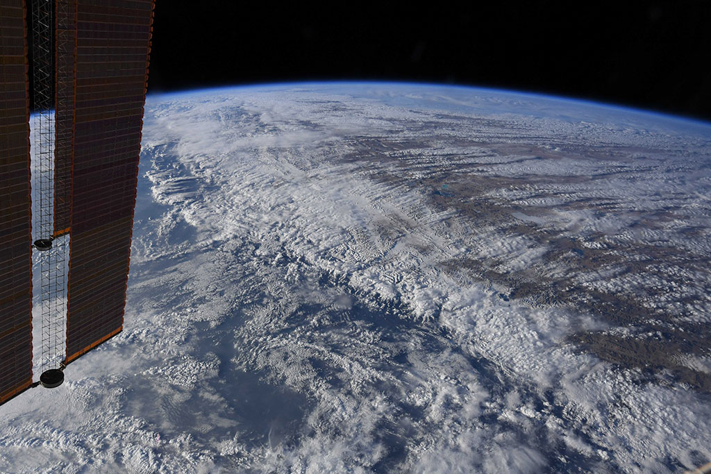 The Himalayas peaking through clouds seen by David Saint-Jacques from the International Space Station. (Credit: Canadian Space Agency/NASA)