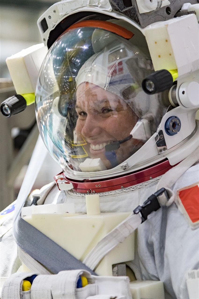 Close up of Jenni wearing a white spacesuit