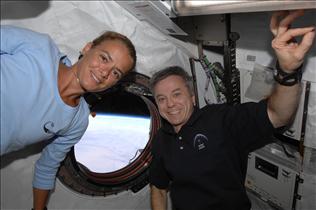 Julie Payette and Bob Thirsk in space