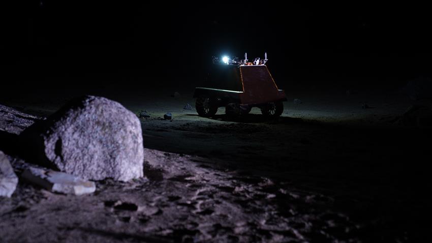 The lunar rover prototype in the darkness.