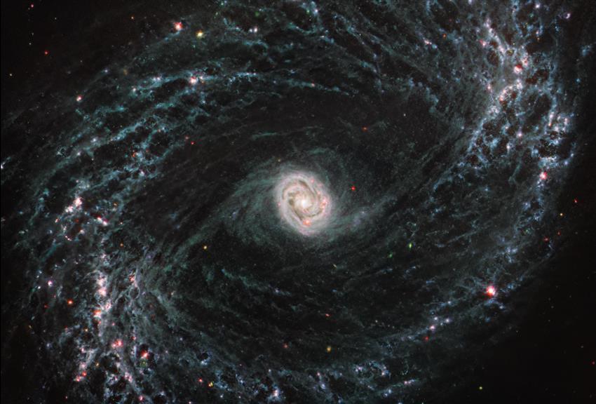 NGC 1433 is a barred spiral galaxy. At its centre is a bright core featuring a unique double ring structure.