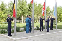 Astronauts conduct a traditional flag-raising ceremony