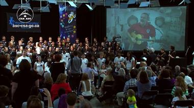 Thumbnail for video 'Chris Hadfield and students from coast-to-coast fill the sky with music (excerpt)'